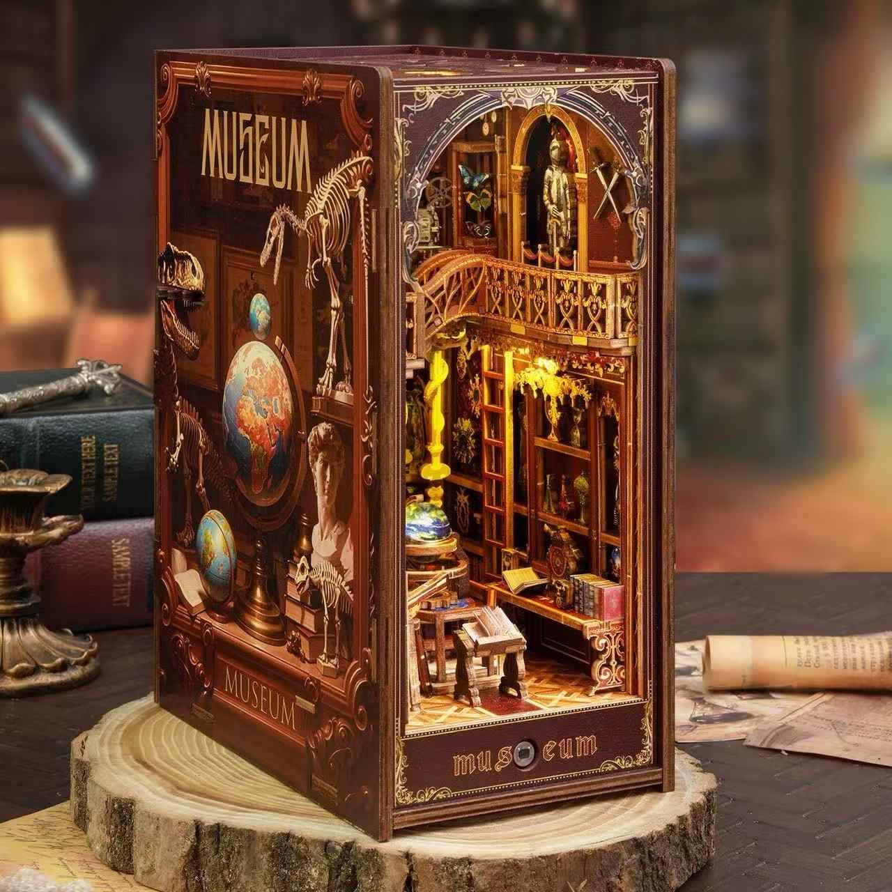 Model of a miniature museum inside a book nook with various exhibits.