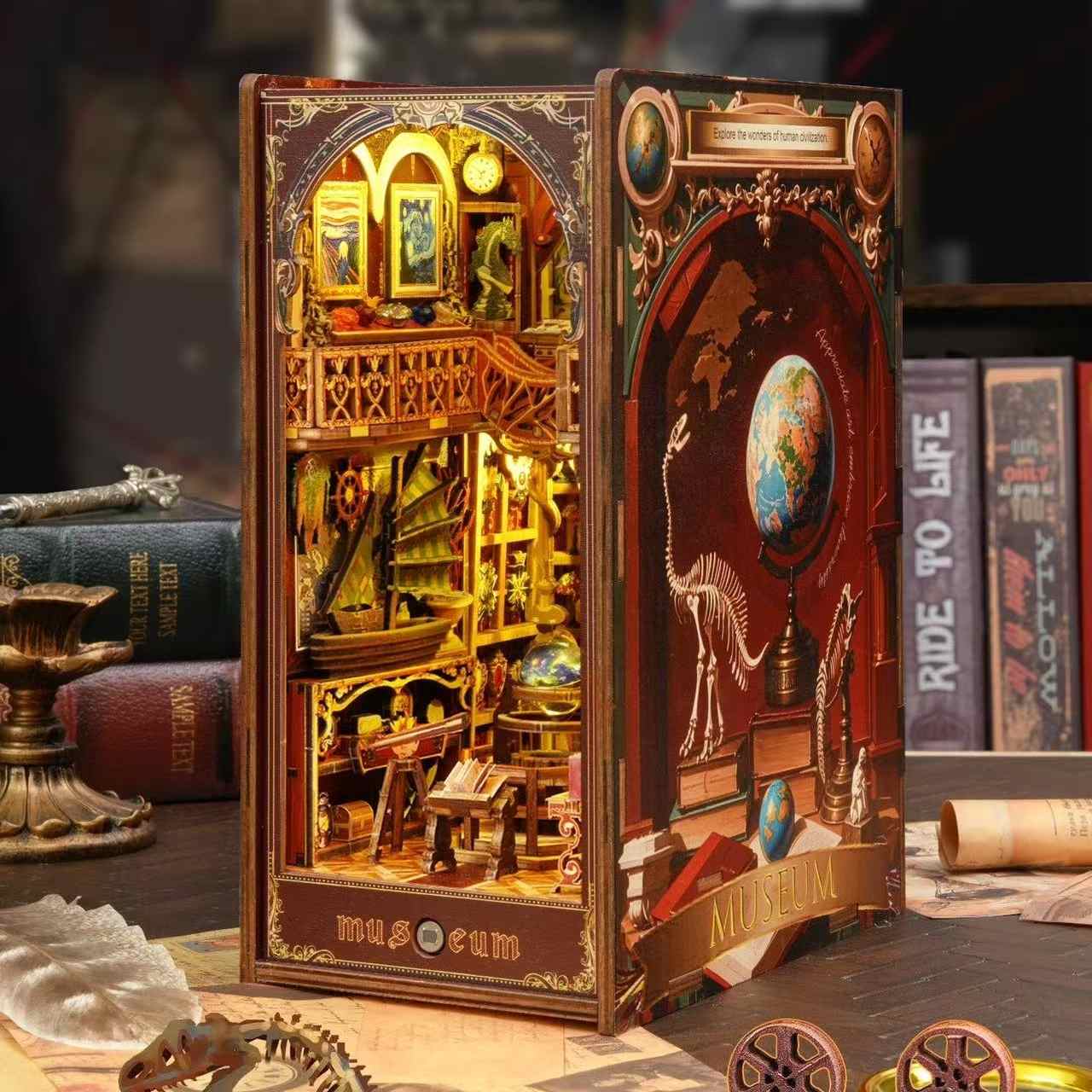 Detailed miniature model of a museum inside a book nook with decorative elements.