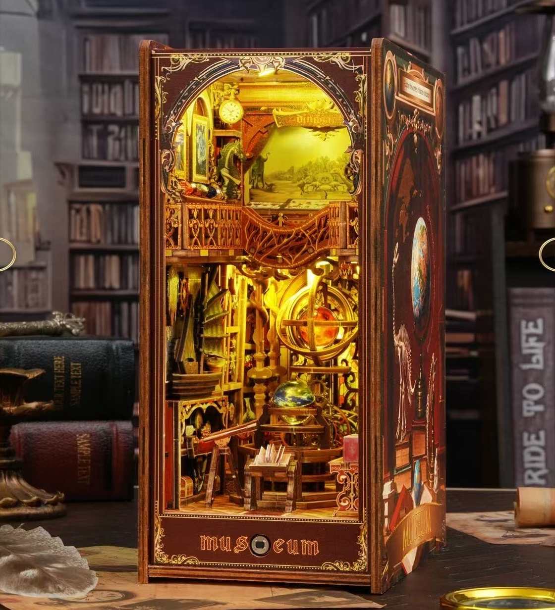 miniature book nook model with intricate design and warm lighting, resembling a museum exhibit, in a bookshelf setting.