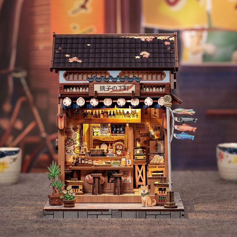Miniature House of a traditional Japanese restaurant with illuminated interior