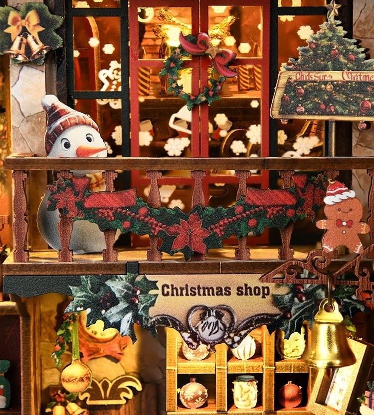 close up the Decorative Christmas shop Book Nook display with gingerbread man, snowman, and festive decorations.