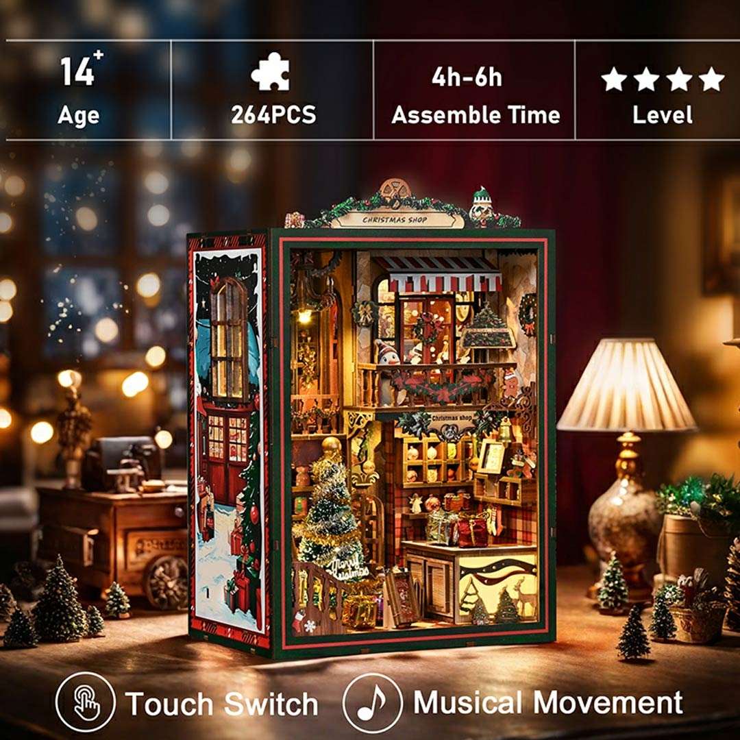 Christmas-themed book nook with miniature scenes on a wooden table, surrounded by festive decorations.