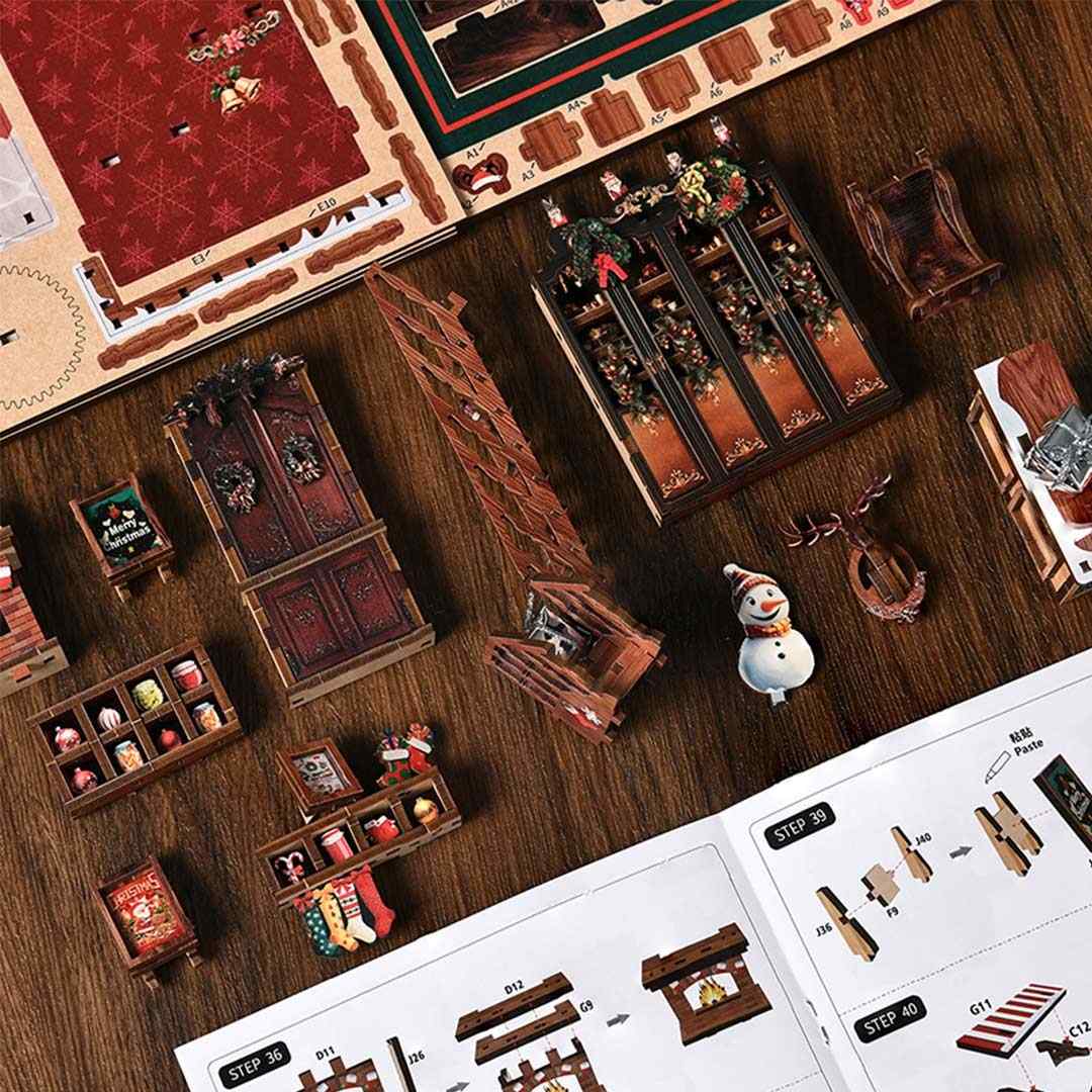 Wooden Christmas-themed miniature sets on a wooden surface with instructions