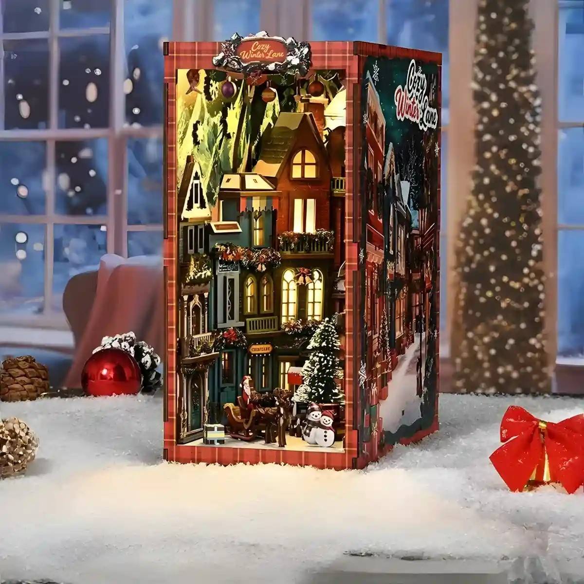 Decorative Christmas street book nook with lights and snow, surrounded by festive decorations.