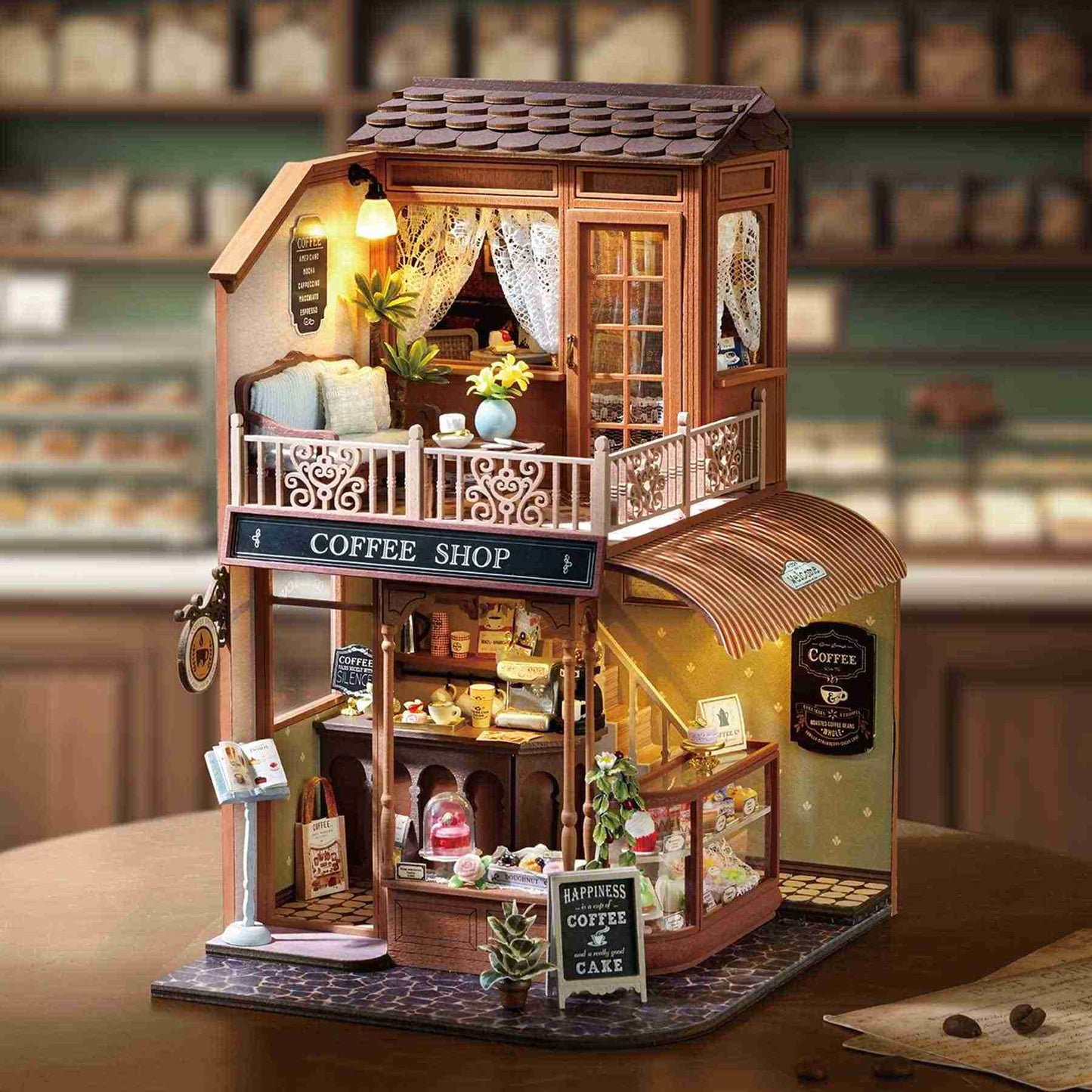 Miniature House of a coffee shop with detailed interior and 'Coffee Shop' sign on table as a home decor piece