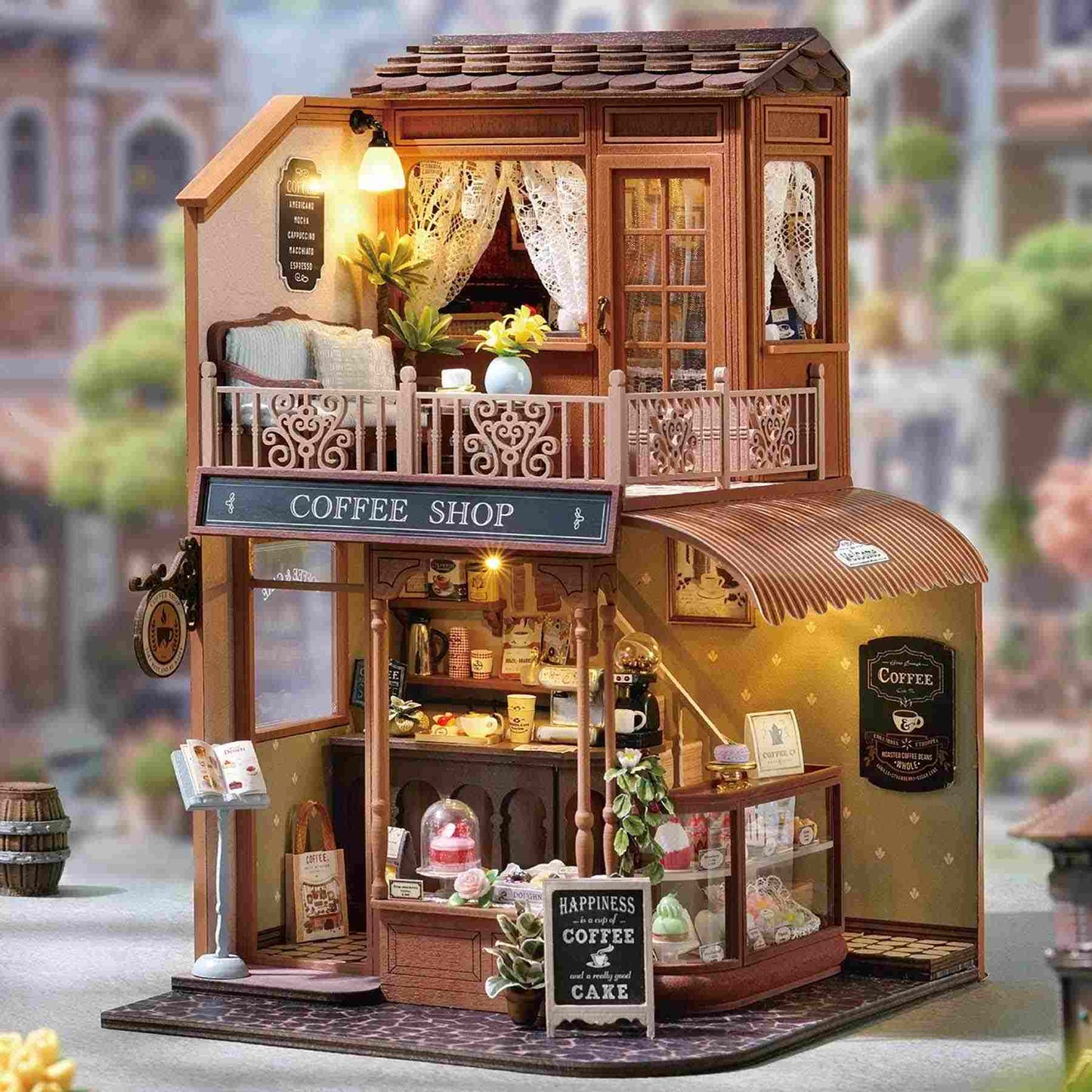 dollhouse of a coffee shop with detailed interior and exterior, set against a blurred street background.