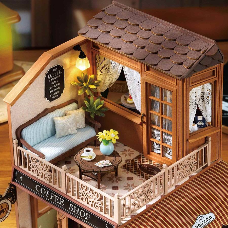 close up the miniature scene on the second floor of a coffee shop with furniture and decor inside