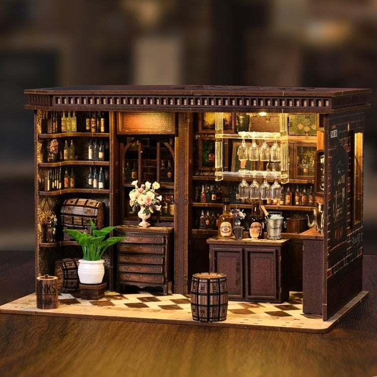 Detailed model of a bar with shelves, bottles, and decor on a wooden base.