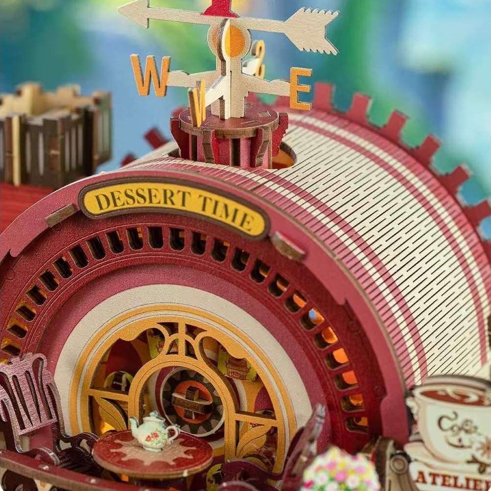 Decorative clock with 'DESSERT TIME' sign and tea set on a colorful background