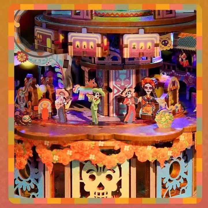 Colorful wooden model of a Coco-Inspired miniature music box with animated characters and decorative elements.