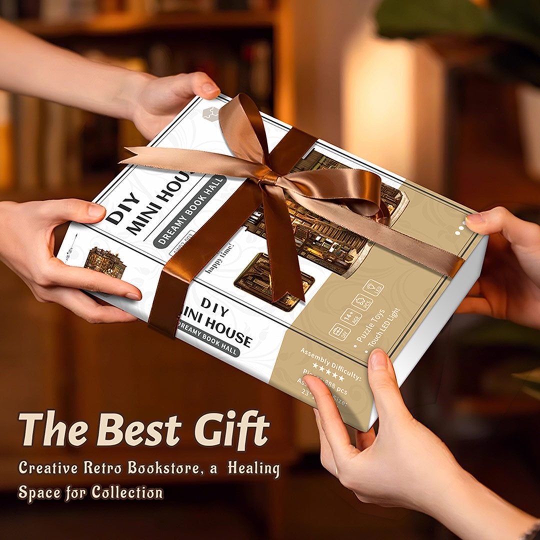 Two hands holding a gift box of Dreamy Book Hall Miniature House