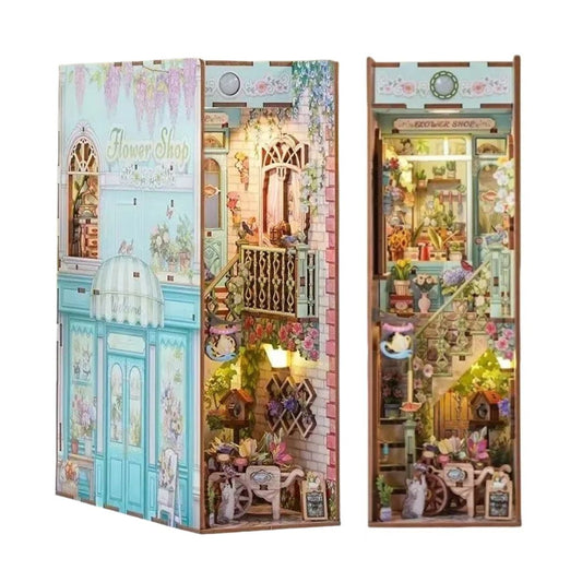 Miniature Model of a flower shop with detailed interior and exterior, displayed in a book nook box.