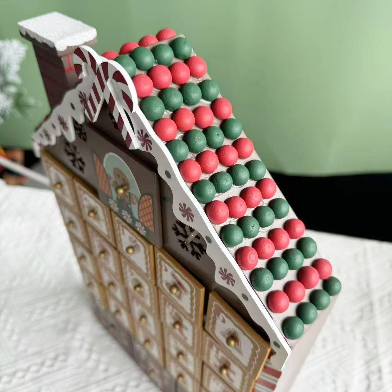 close-up of the roof of the Gingerbread House Wooden Advent Calendar