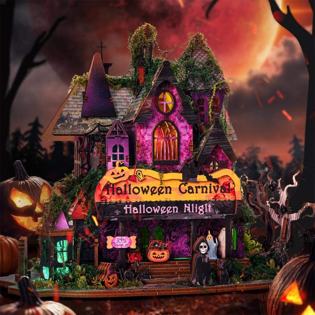 Halloween-themed dollhouse with glowing lights and pumpkins against a dark sky.