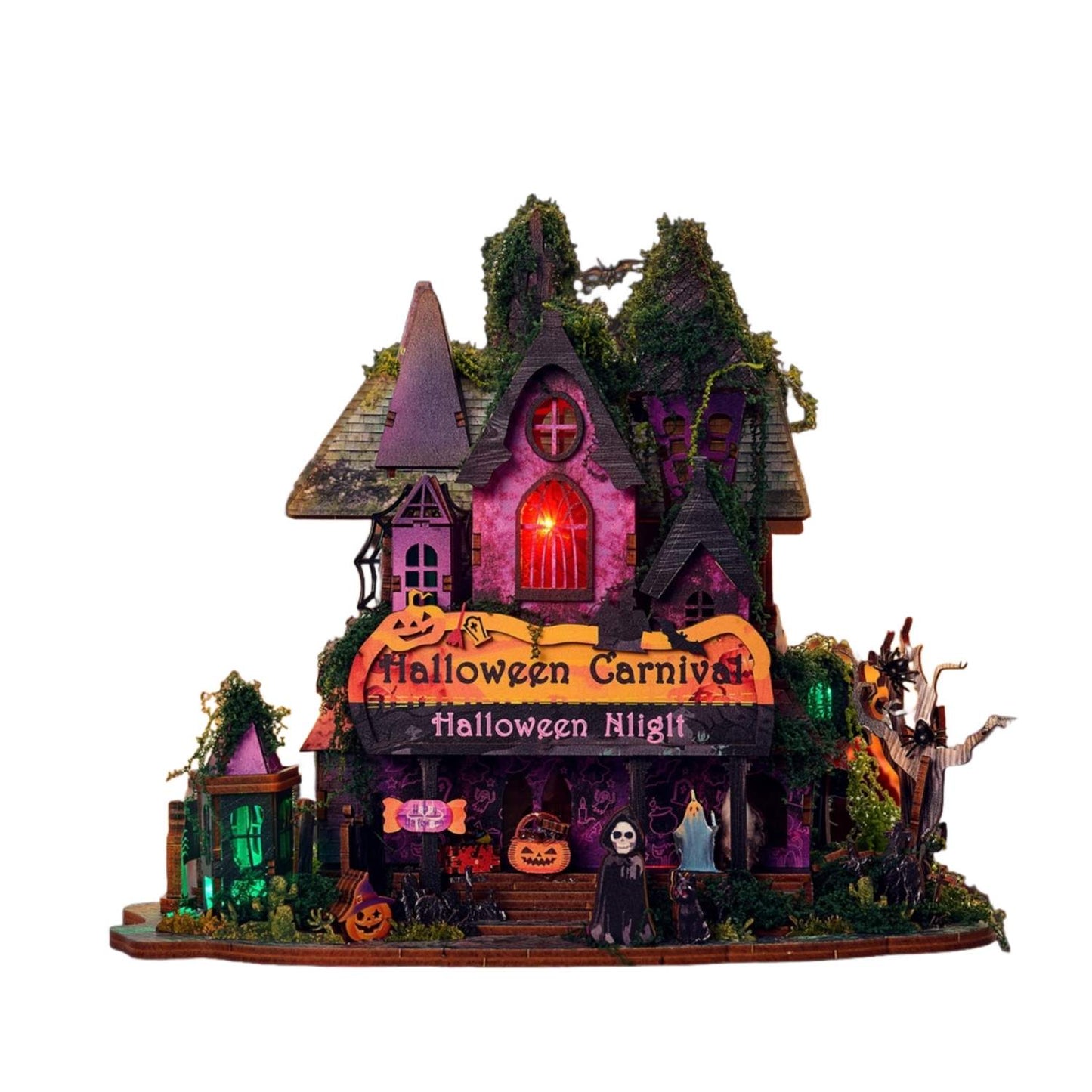 assembled Halloween miniature house with illuminated lights on a white background