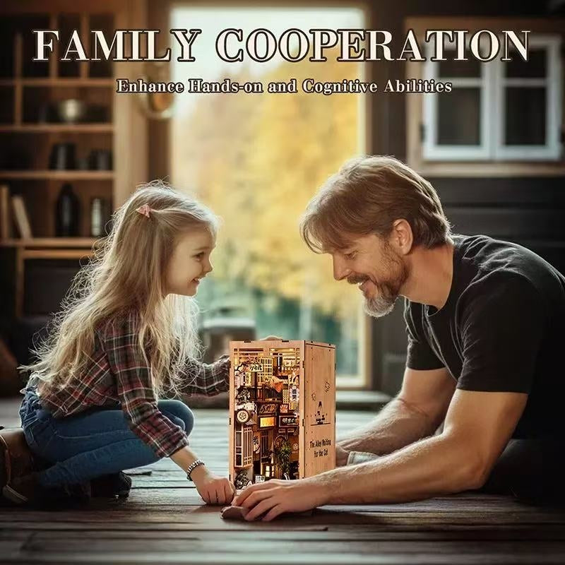 Man and young girl playing with a wooden book nook model kit on a wooden floor.