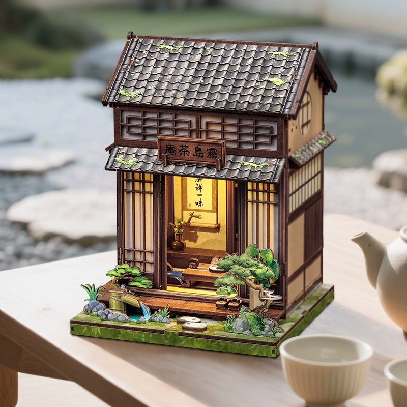 Dollhouse Model of a traditional Japanese tea house with a scenic background