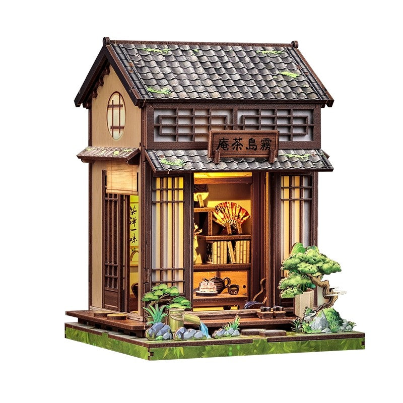 Book Nook Model of a traditional Japanese tea house with open doors, shelves, and decorative elements.