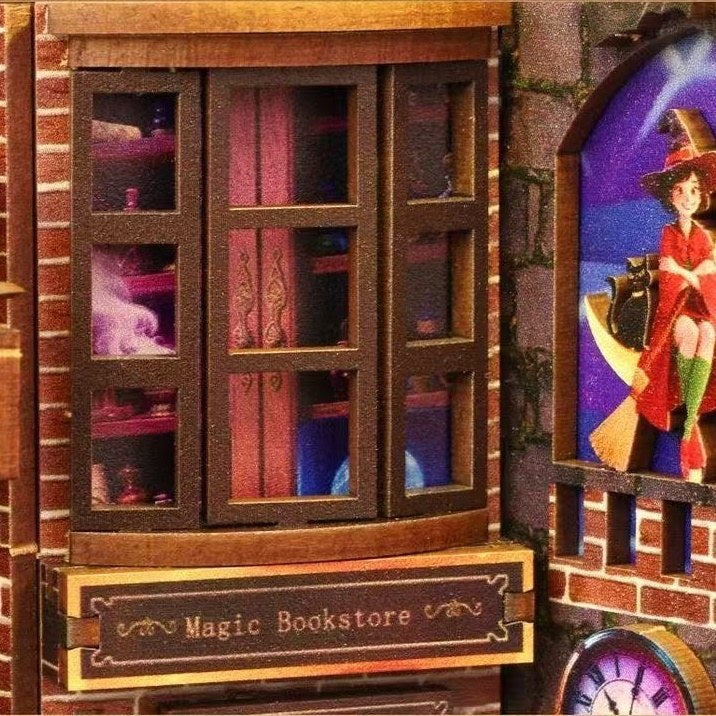 Miniature model of a magic bookstore with a witch illustration on a wall.