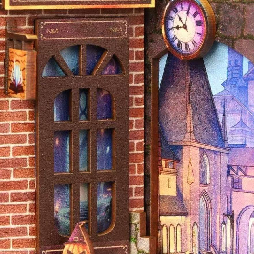 Decorative miniature clock with stained glass design on a brick wall