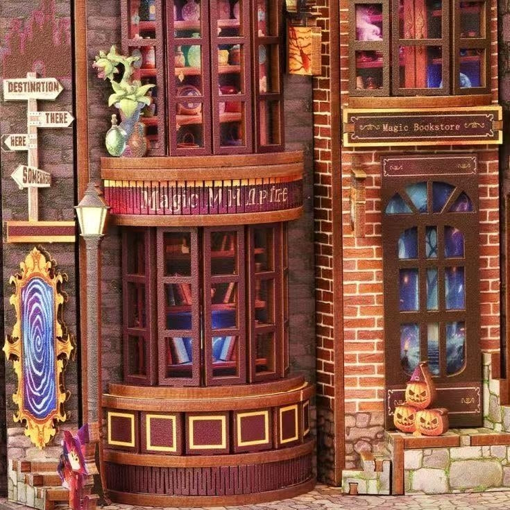 Decorative magic shop windows with books and a small figure in front of a brick building with a window display.