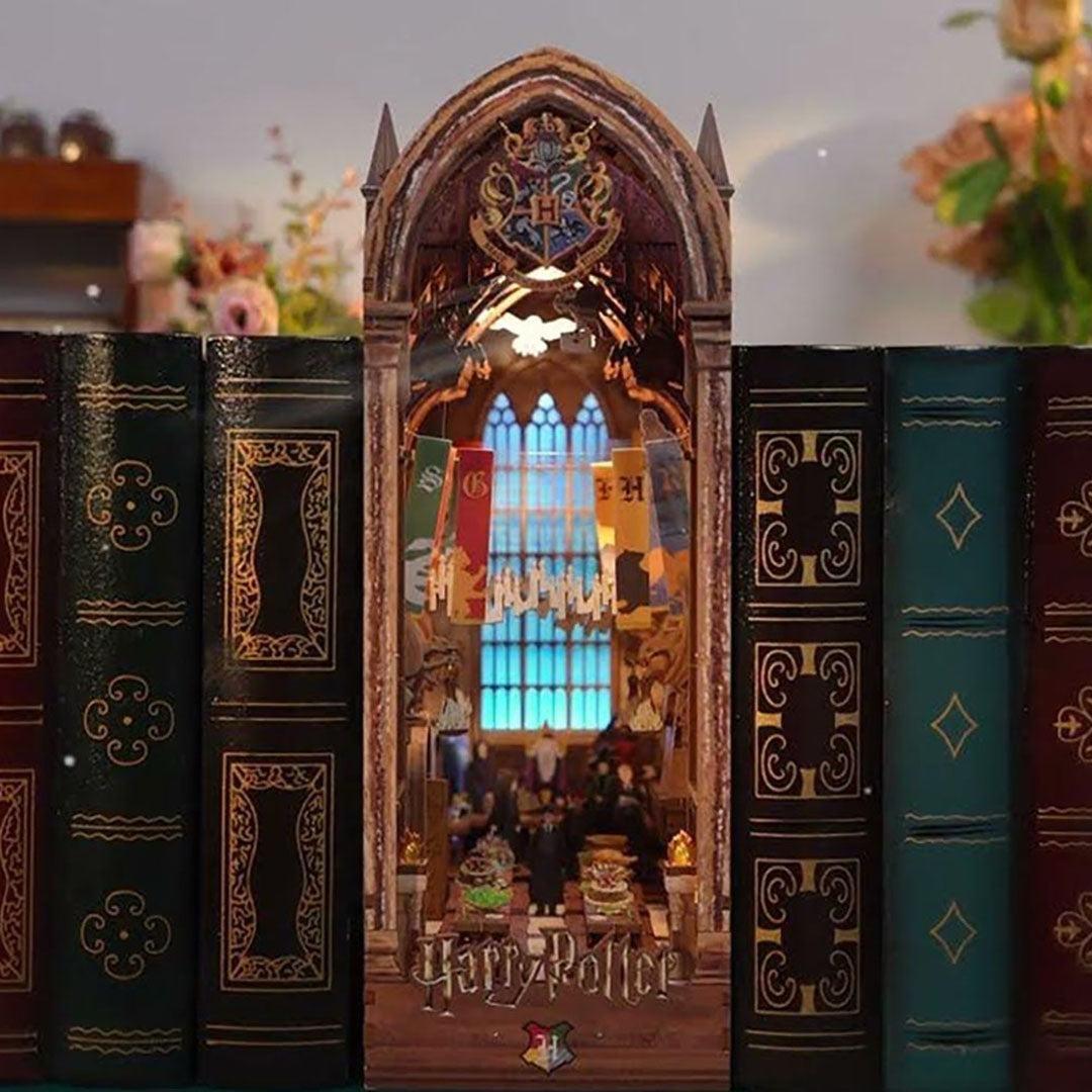 Decorative bookshelf with a miniature Hogwarts castle book nook model inside