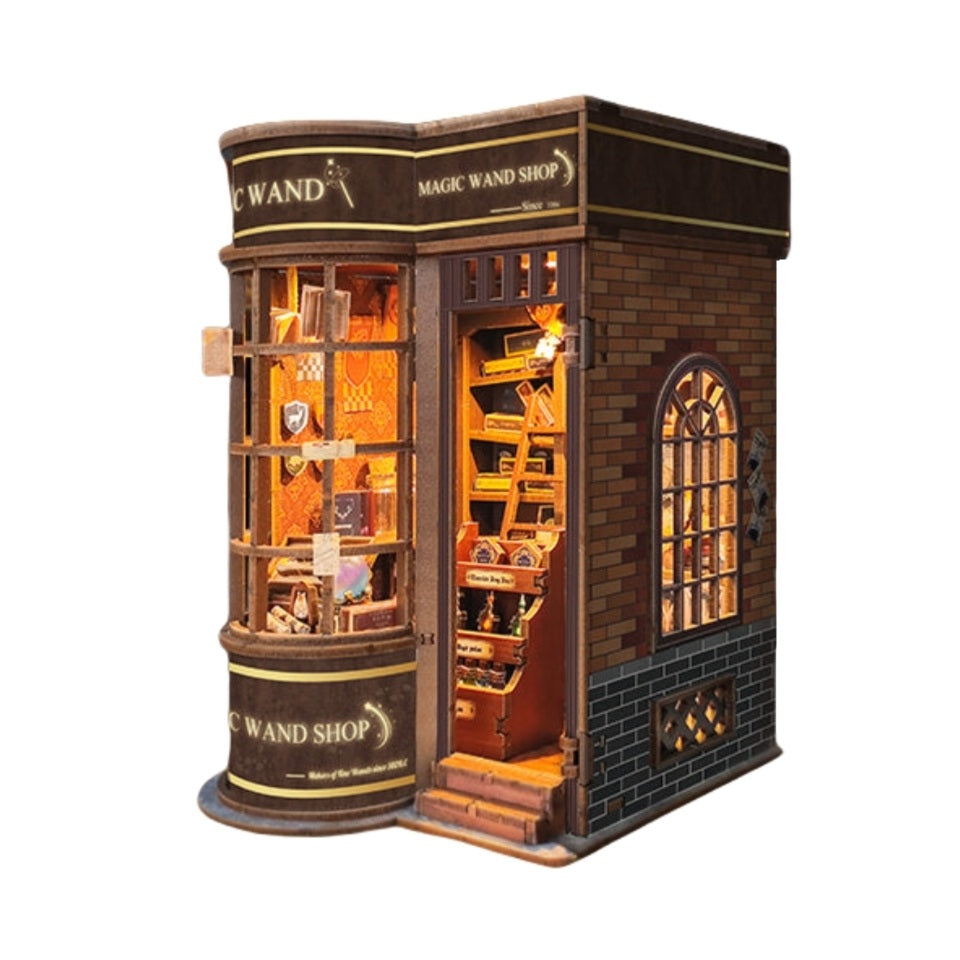Model of a magic wand shop with illuminated interior on a white background