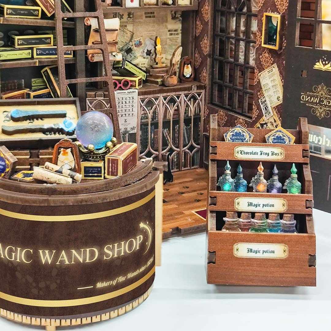 Miniature furniture of a magic wand shop with various items and a barrel labeled 'Magic Wand Shop'.