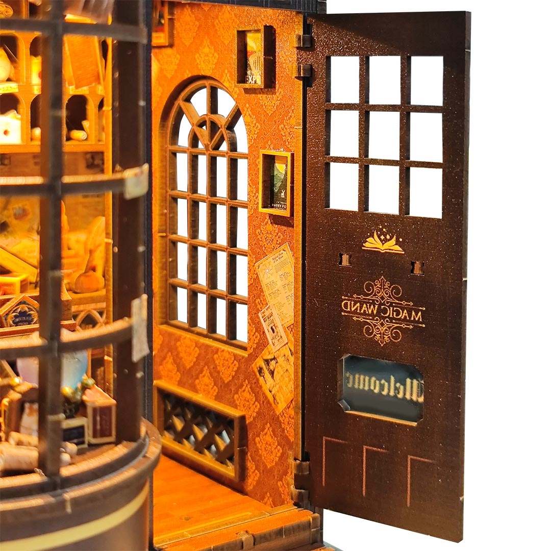 Wooden model of a magic wand shop with an open door, featuring intricate details and a visible brand name.