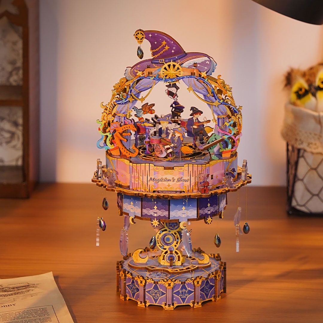 assembled wooden 3D wooden Magician's Show music box puzzles on a wooden surface