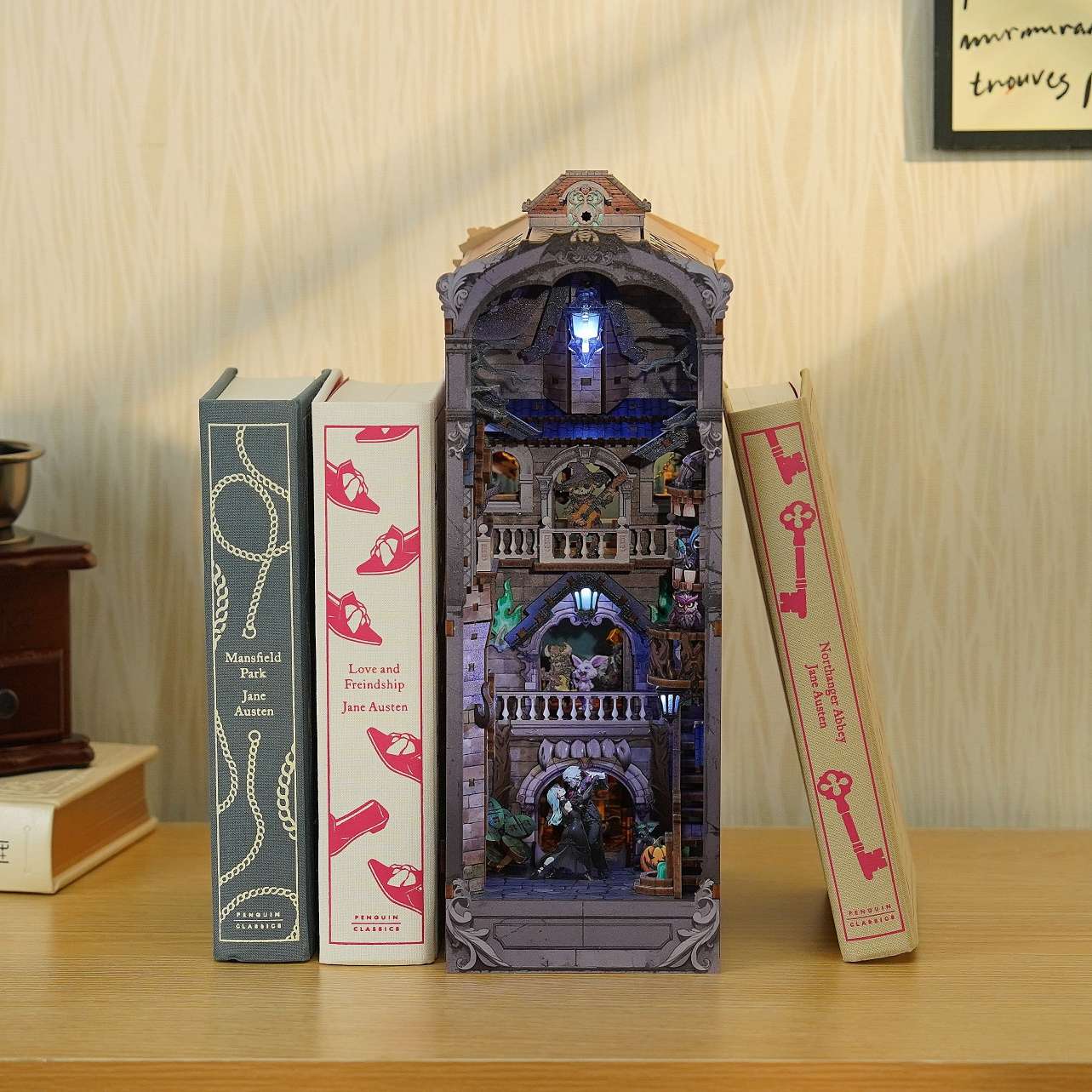 Decorative bookshelf with a miniature book nook model of a castle