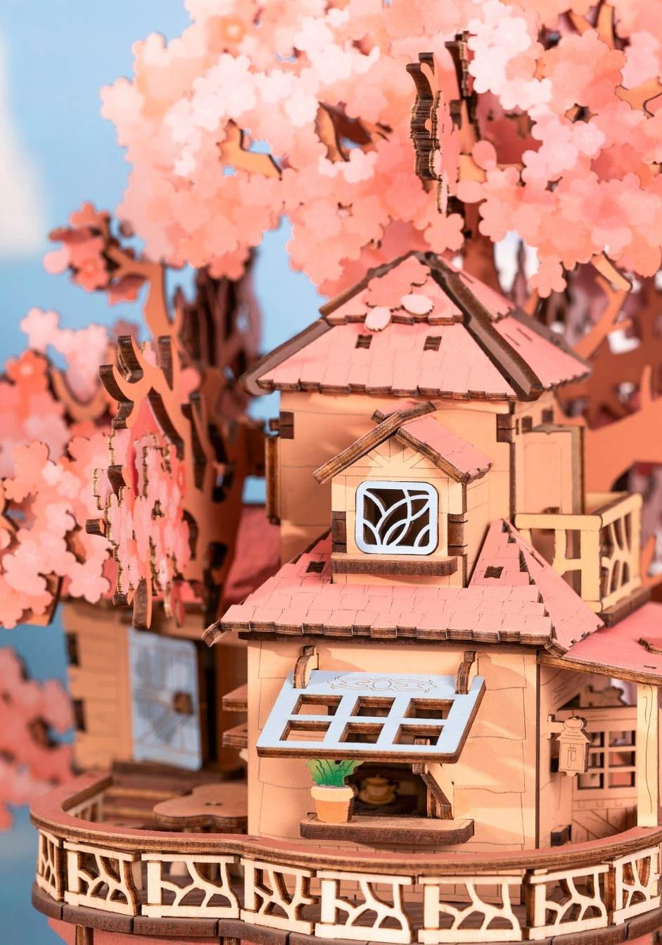 3D Wooden Puzzle model of a tree house with cherry blossom trees