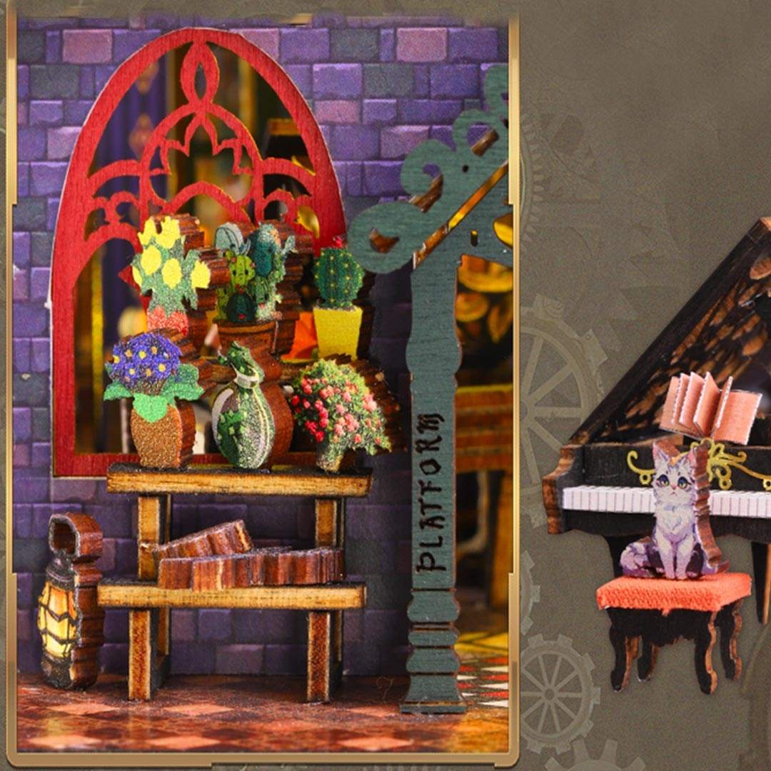 Miniature diorama with a shelf of plants and a cat on a piano, set against a purple brick wall.