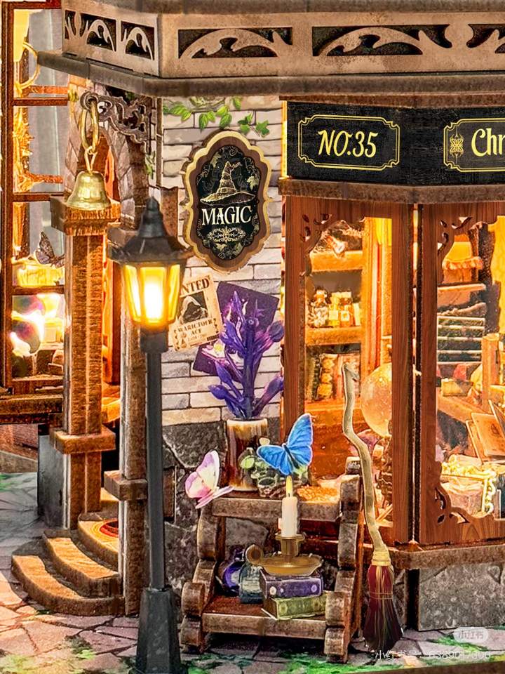 Miniature magical shop with various items and a street lamp.