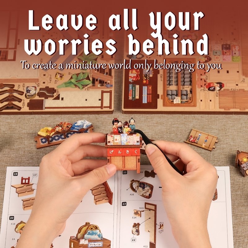Miniature model building set with hands assembling a structure, text 'Leave all your worries behind' above.