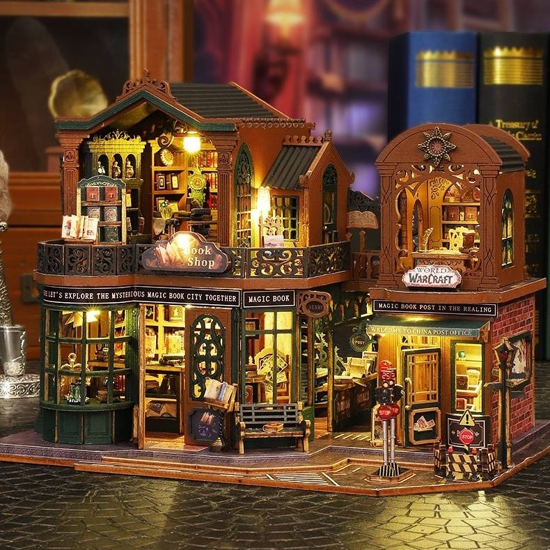 image displaying an assembled Twilight Bookstore DIY Miniature House Kit with lights on in a vintage table setting