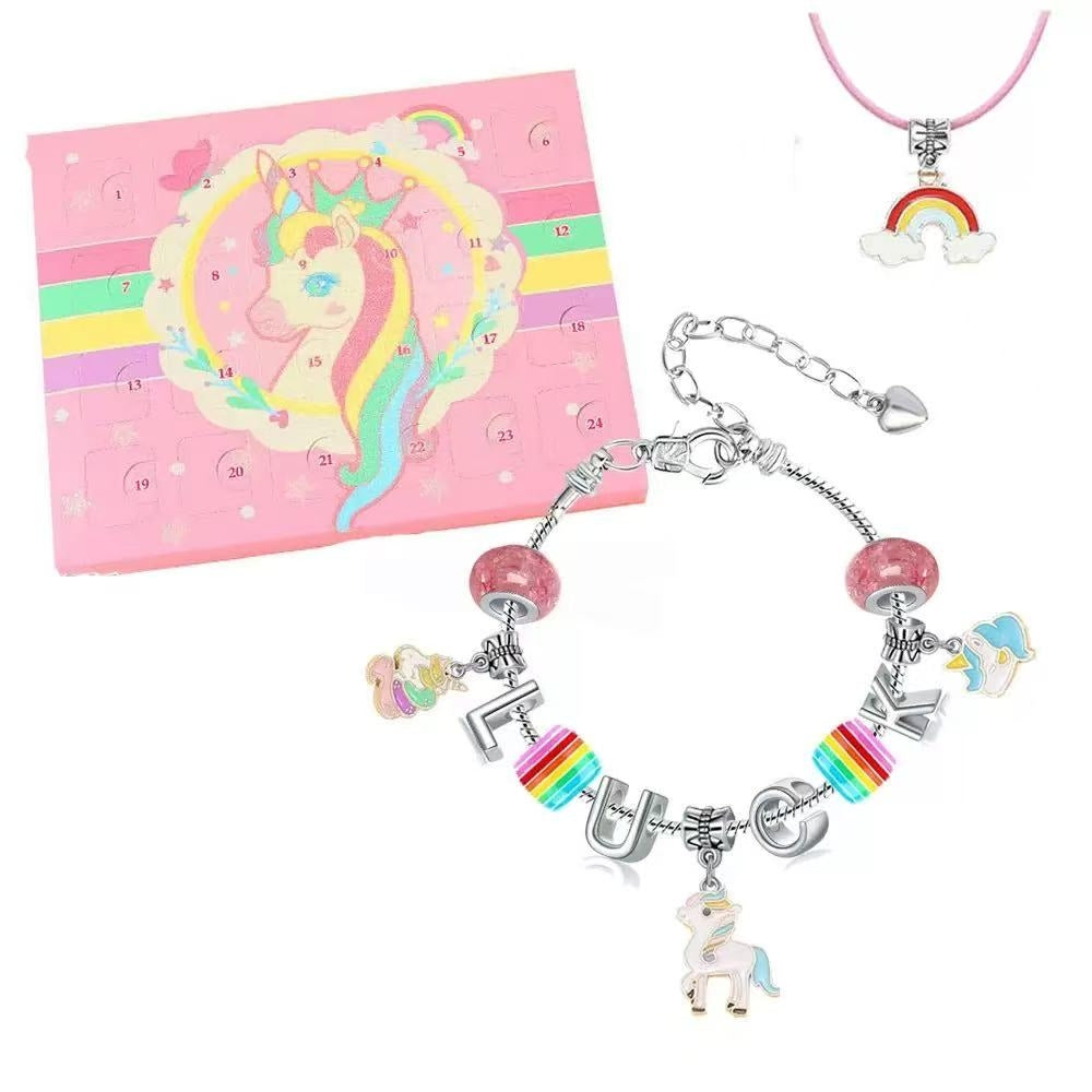 Children's jewelry set with unicorn and rainbow charms on a pink Advent Calendar box with unicorn design