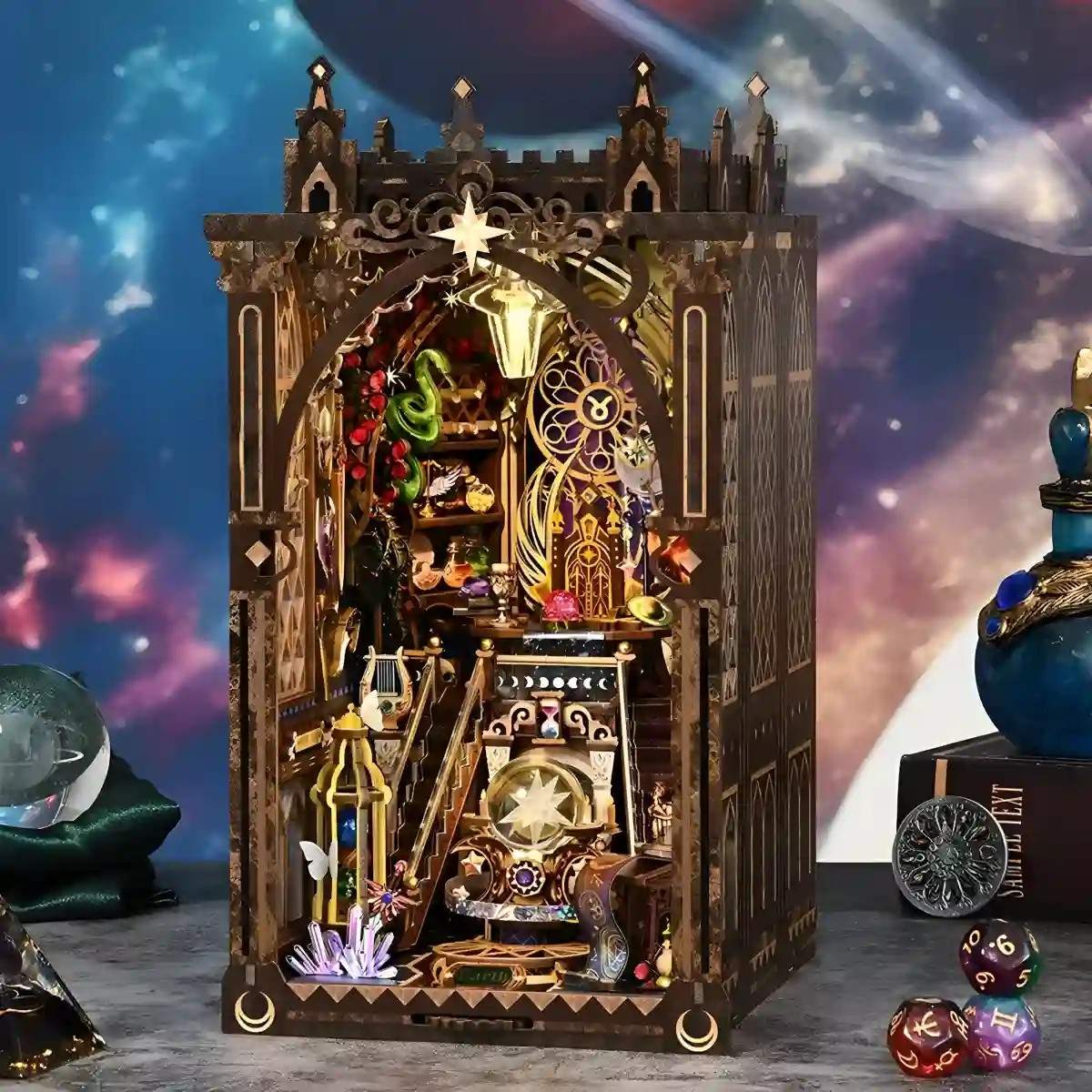 Detailed wooden diorama model of a cathedral with decorative zodiacs elements against a cosmic background