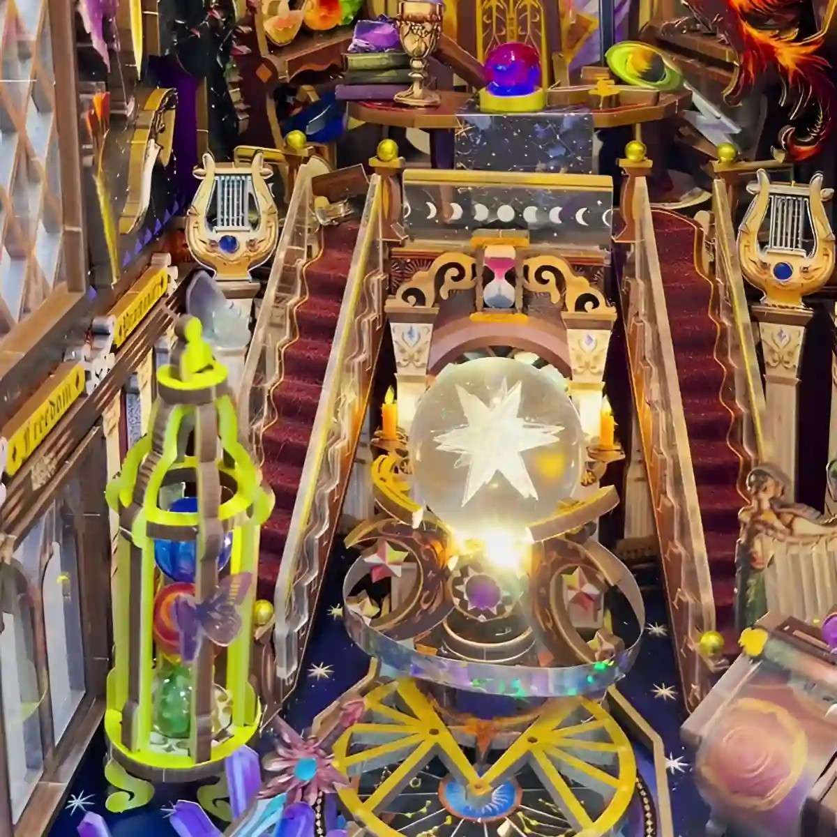 Colorful and intricate diorama model of a fantasy scene with a crystal ball and musical instruments.