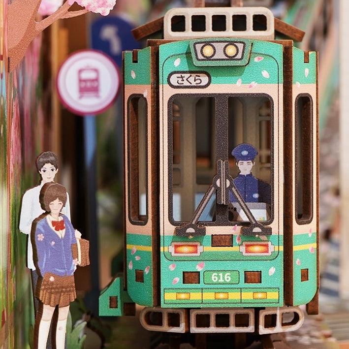 Japanese Sakura Densya DIY Book Nook Kit, A charming miniature 3d wooden puzzles the captures the essence of springtime in Japan, perfect for bookshelf decor or a delightful gift for Japanese culture lovers.