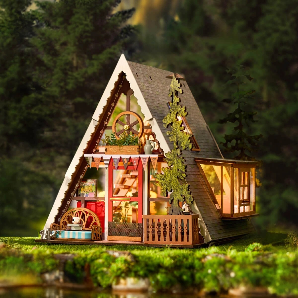 miniature Model of a cabin in the woods with glowing interior lights