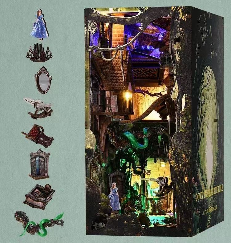 image displaying the finished Alice in Wonderland Down The Rabbit Hole DIY Book Nook Kit, and the main miniature items of it