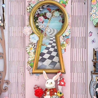 wall art inside a book nook with a keyhole frame, floral elements, and a rabbit figure on a checker path