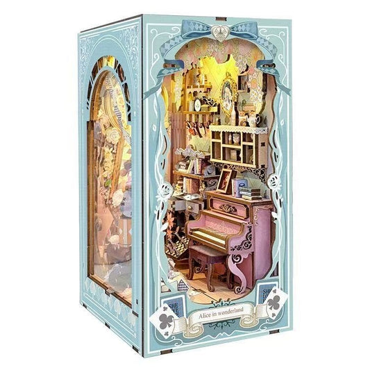 wooden book nook box with a miniature interior featuring a piano and other items, inspired by 'Alice in Wonderland'.