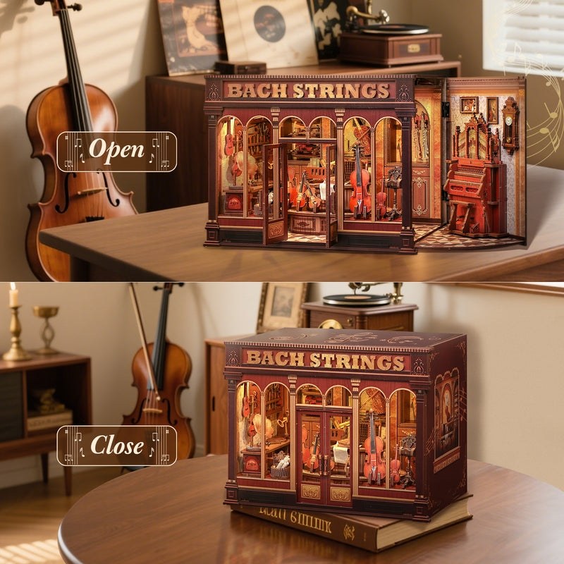 Wooden miniature house model of a music store named 'Bach Strings' with open and closed views on a table.