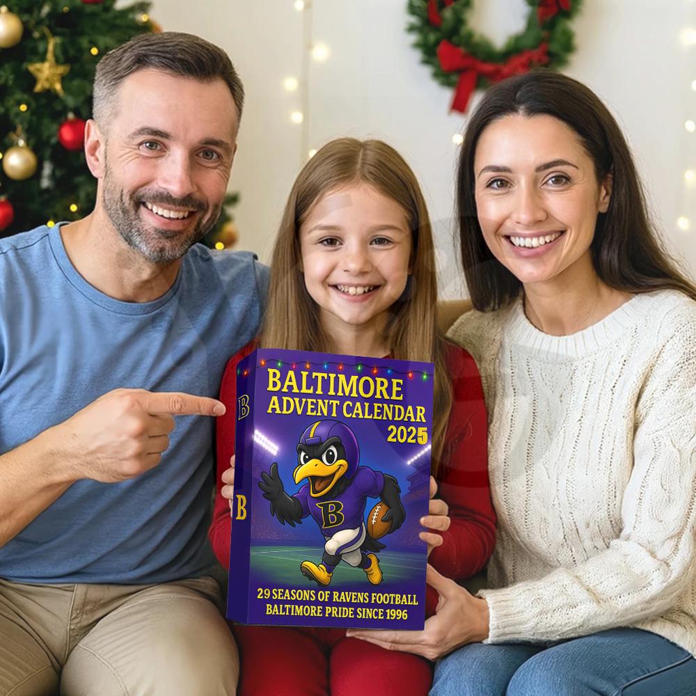 Family holding a Baltimore Ravens Advent Calendar in front of a Christmas tree.