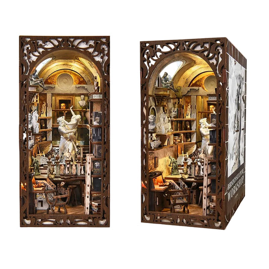 Detailed book nook model of a Baroque Miniature Studio room with shelves and figures, resembling a book or box