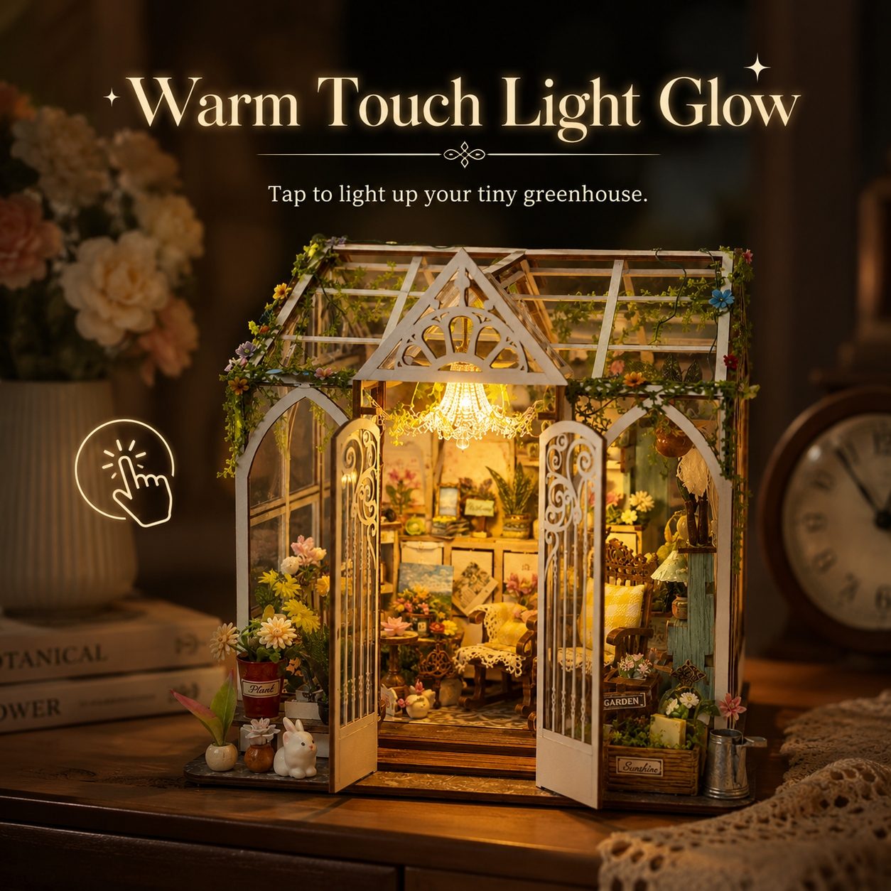 A miniature greenhouse craft with glowing warm lights, displayed on a wooden table in a cozy room setting. The text 'Warm Touch Light Glow' and 'Tap to light up your tiny greenhouse.