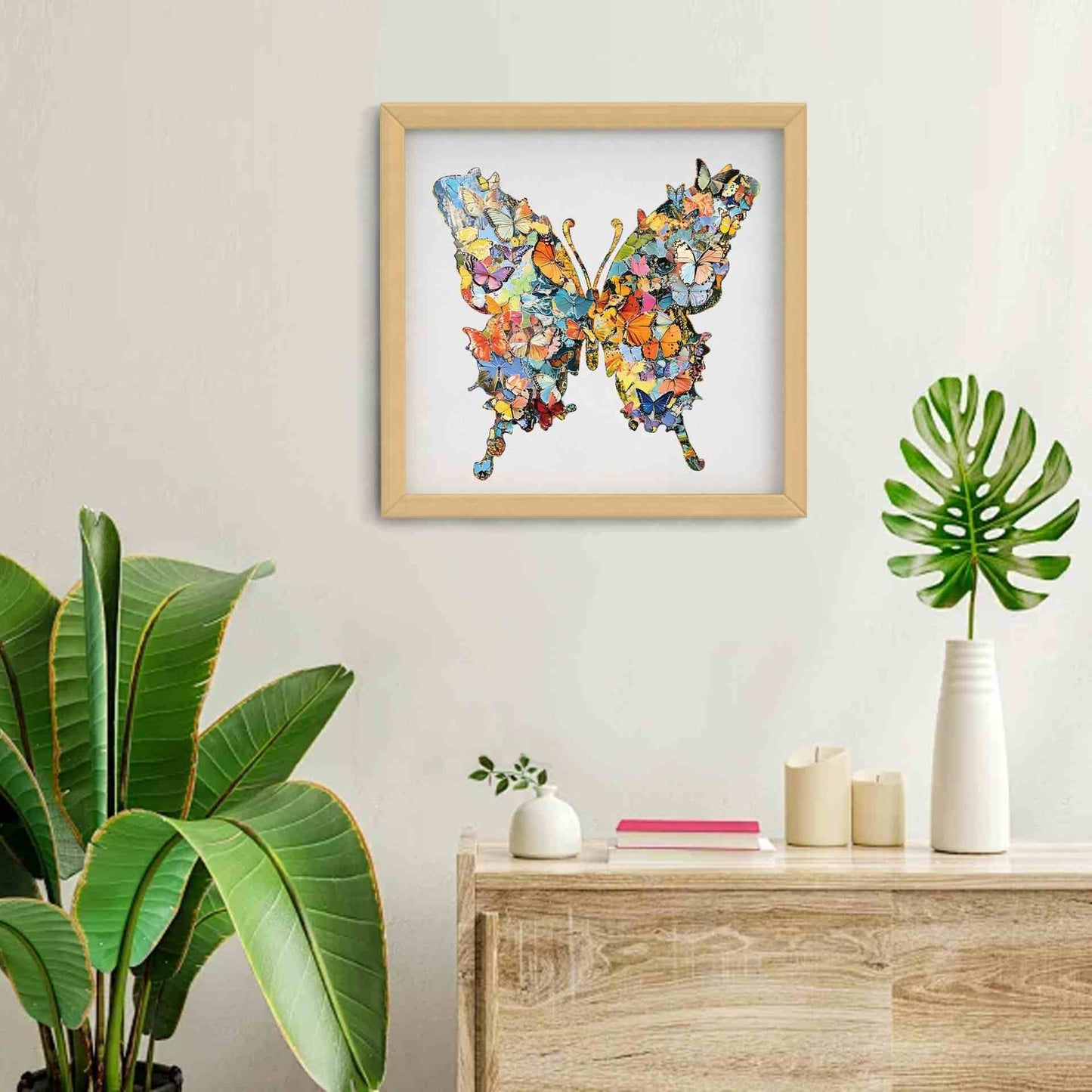 Framed colorful butterfly wooden puzzle on a wall with plants and decor below.