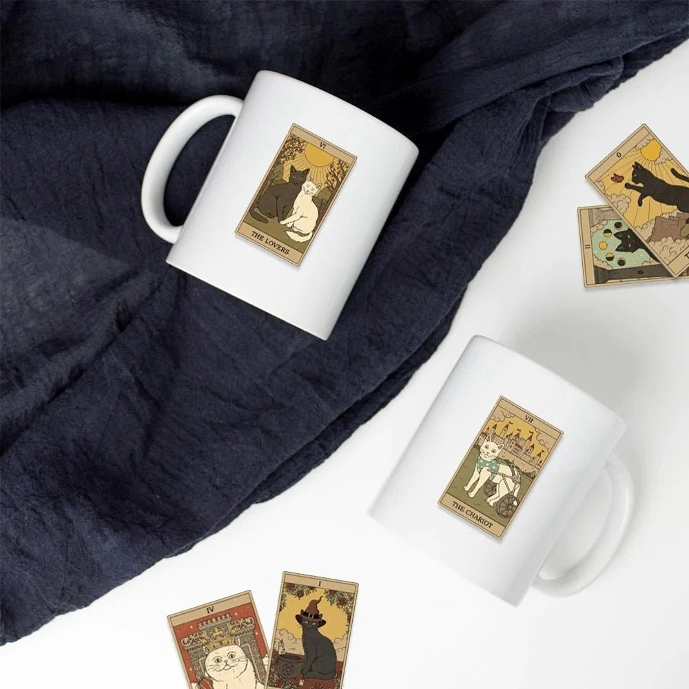 Two white mugs with tarot card design stitclers